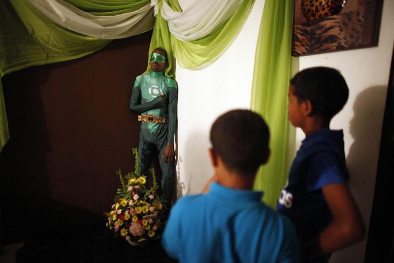 A Dead Puerto Rican Man Was Dressed As Green Lantern And Propped Upright for His Wake